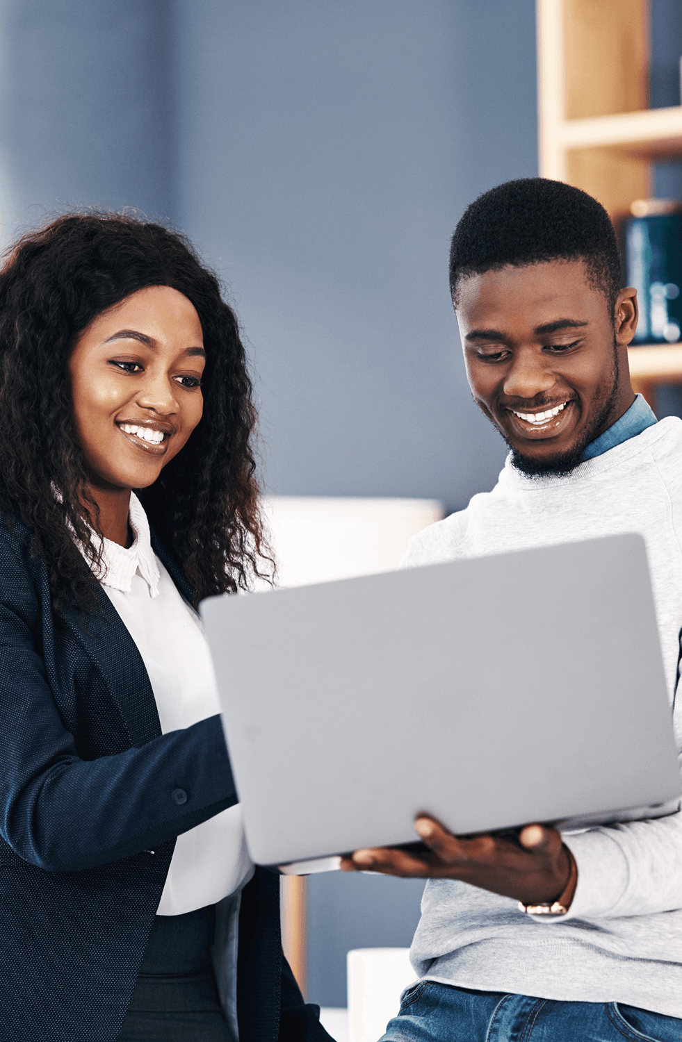 Two teammates using DigiTax together on a laptop.