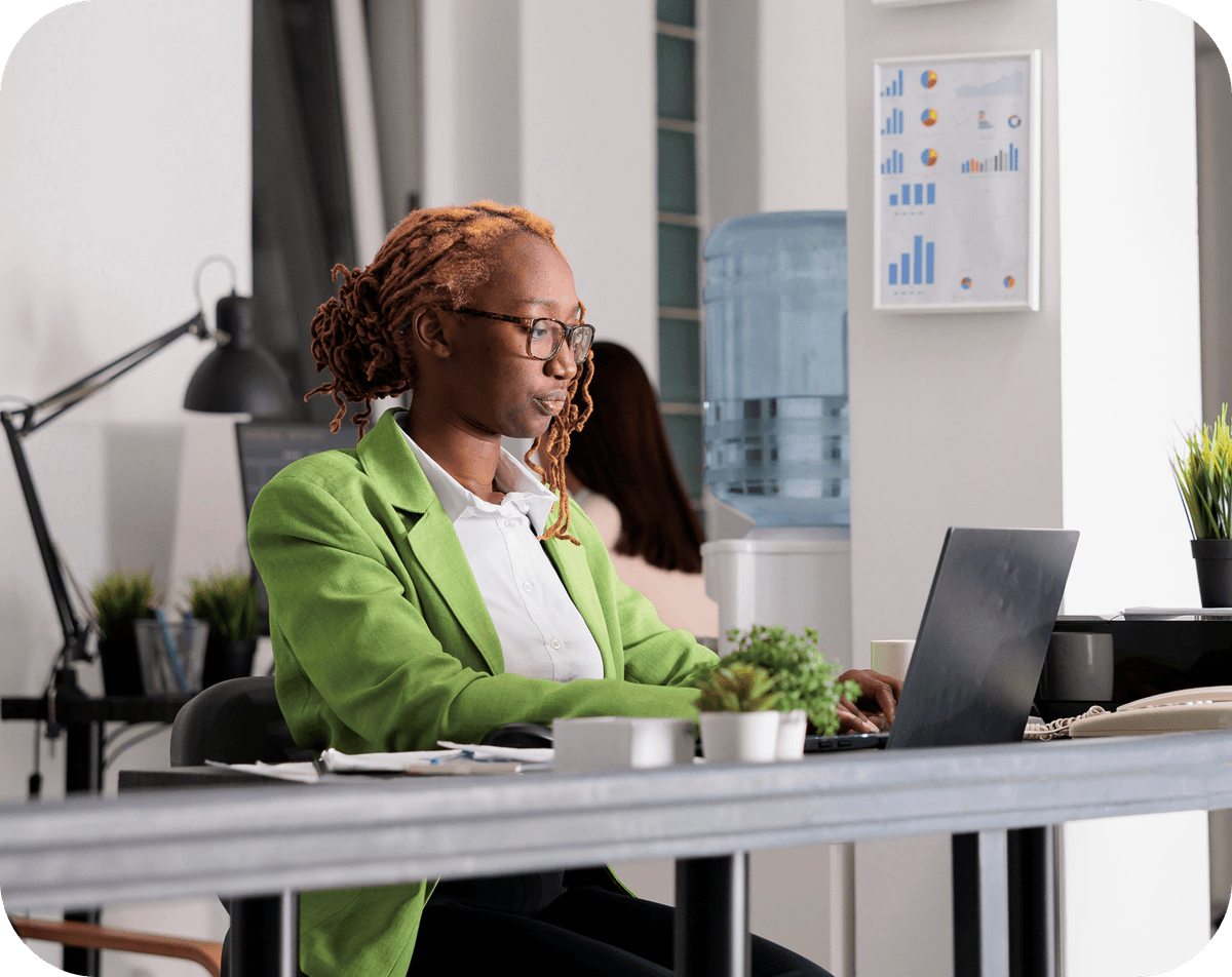 Woman working on a laptop.